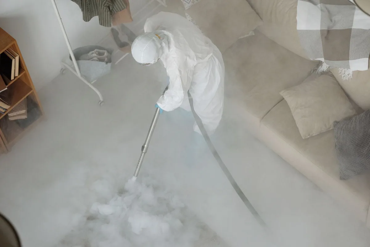 Biohazard cleanup technician in protective equipment, East Quincy, CA